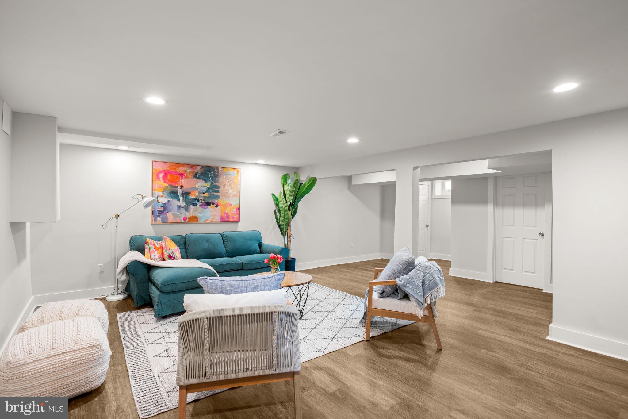 3908 Rayton Road Randallstown, MD 21133 - Photo 33 of 42 a living room with furniture and wooden floor