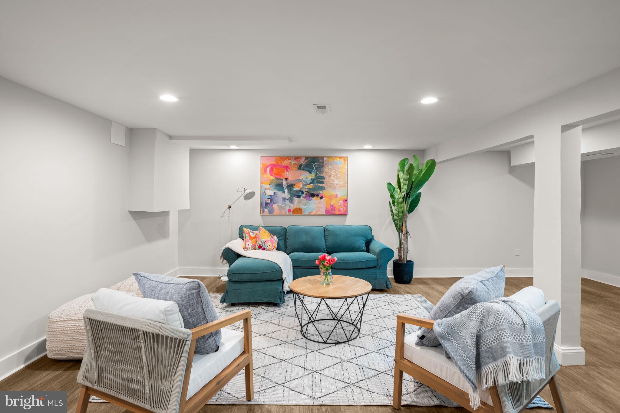 3908 Rayton Road Randallstown, MD 21133 - Photo 34 of 42 a living room with furniture and a potted plant