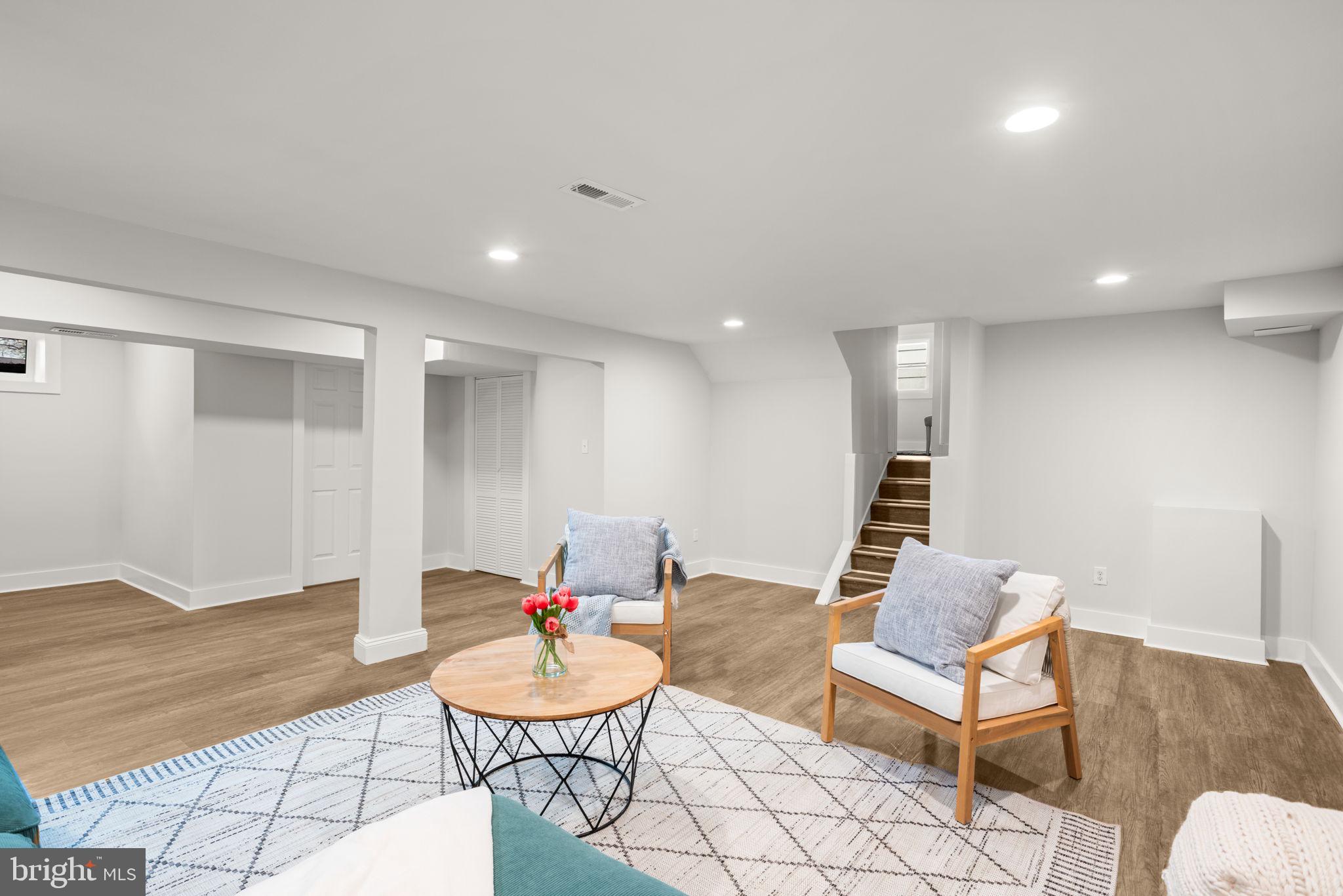 3908 Rayton Road Randallstown, MD 21133 - Photo 36 of 42 a living room with furniture and a wooden floor
