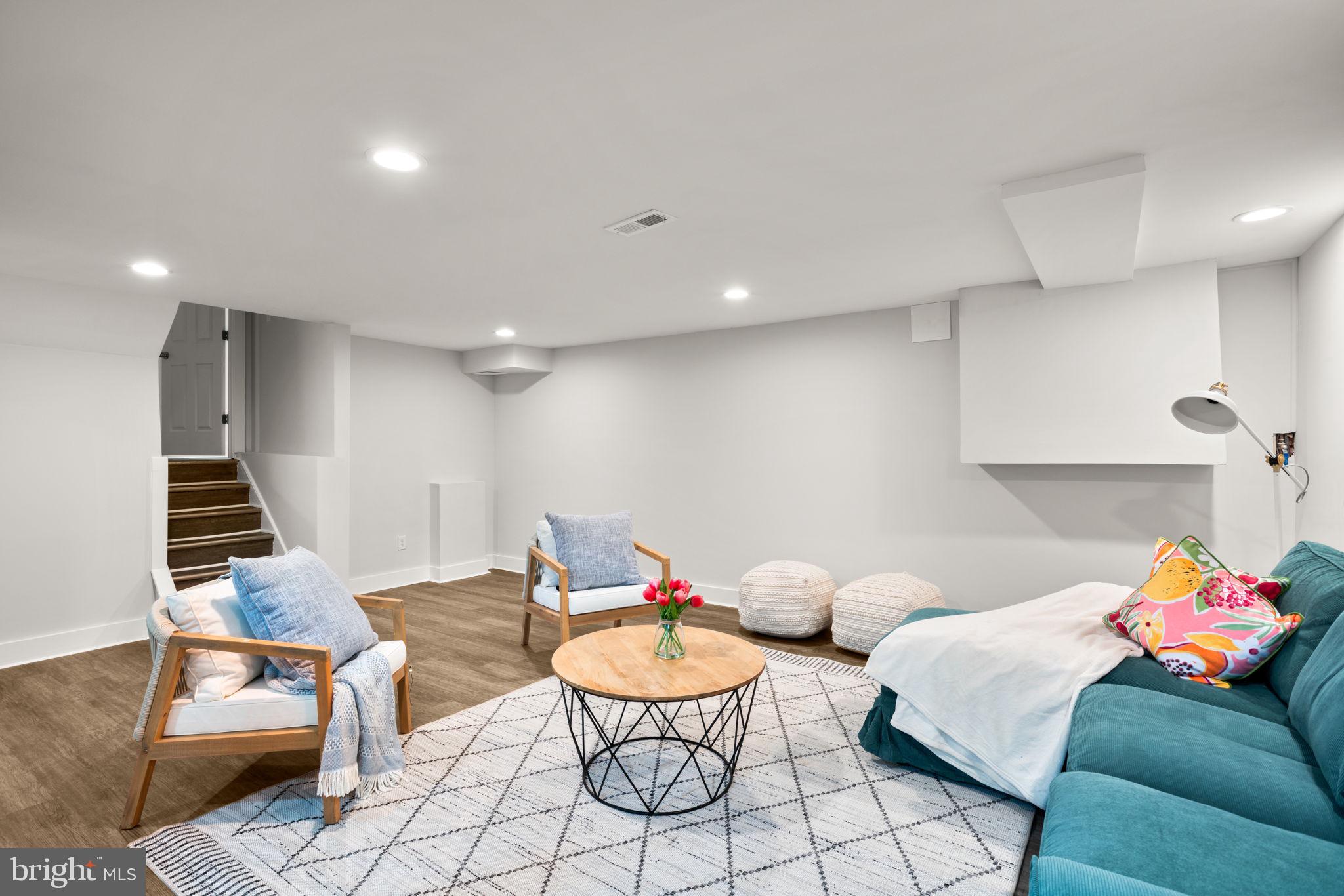 3908 Rayton Road Randallstown, MD 21133 - Photo 37 of 42 a living room with furniture and wooden floor