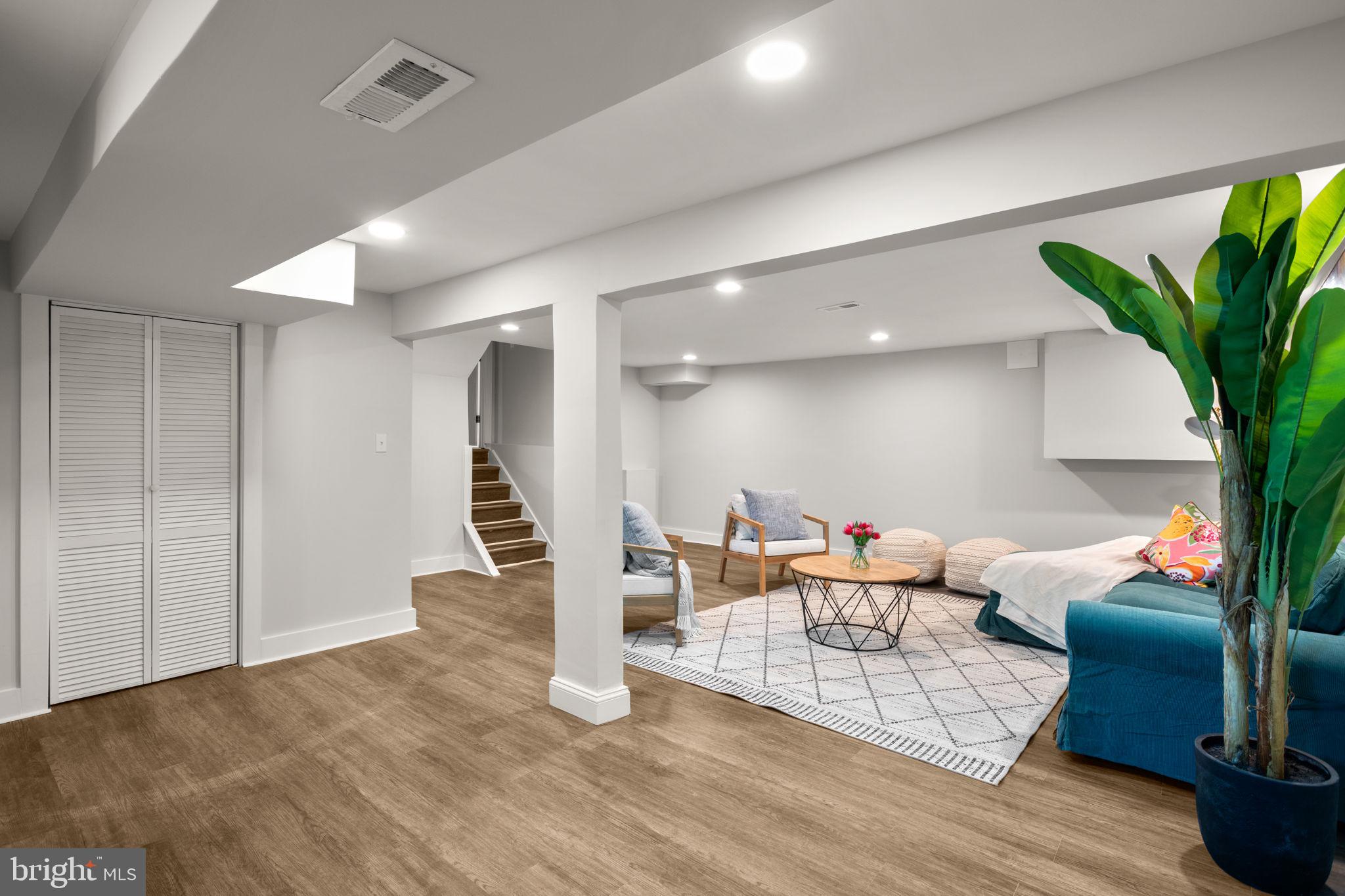 3908 Rayton Road Randallstown, MD 21133 - Photo 38 of 42 a living room with furniture and a potted plant