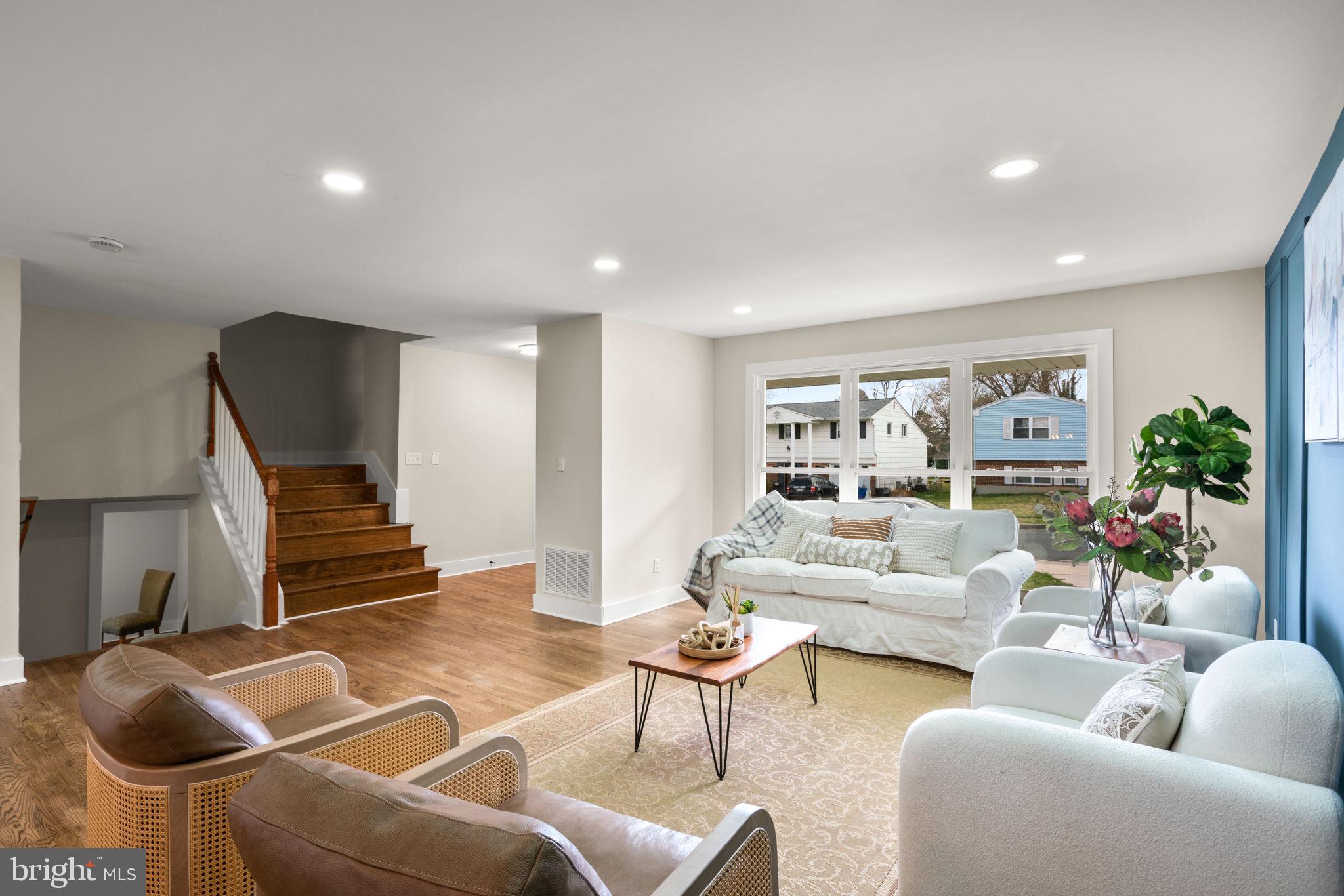 3908 Rayton Road Randallstown, MD 21133 - Photo 5 of 42 a living room with furniture and a lamp