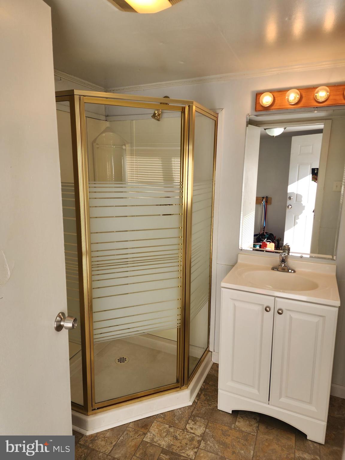 119 North Brandywine Avenue Modena, PA 19320 - Photo 12 of 13 a bathroom with a shower sink and mirror