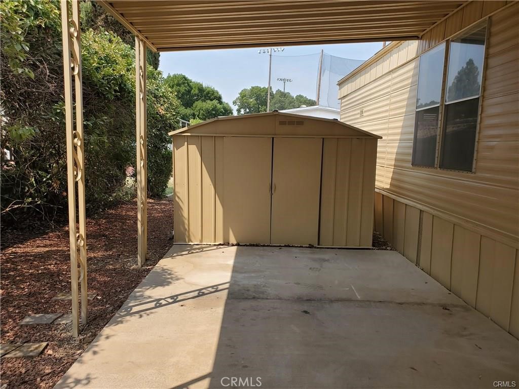 2240 Golden Oak Lane, Unit 132 Merced, CA 95341 - Photo 2 of 13 a yellow house with a outdoor space
