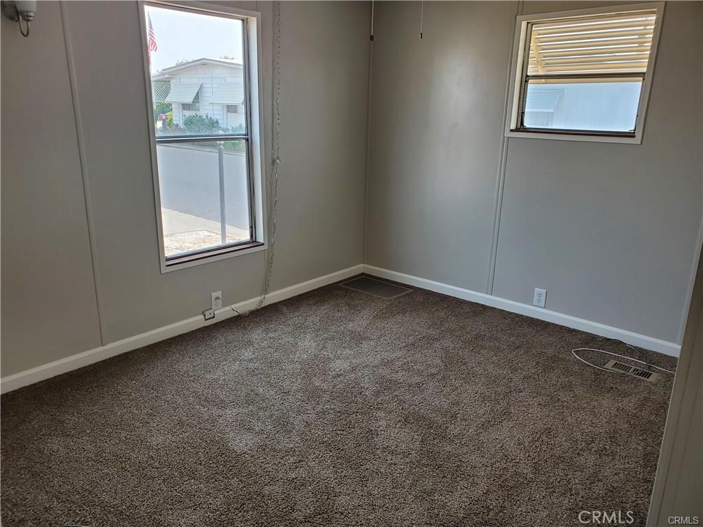 2240 Golden Oak Lane, Unit 132 Merced, CA 95341 - Photo 7 of 13 an empty room with windows