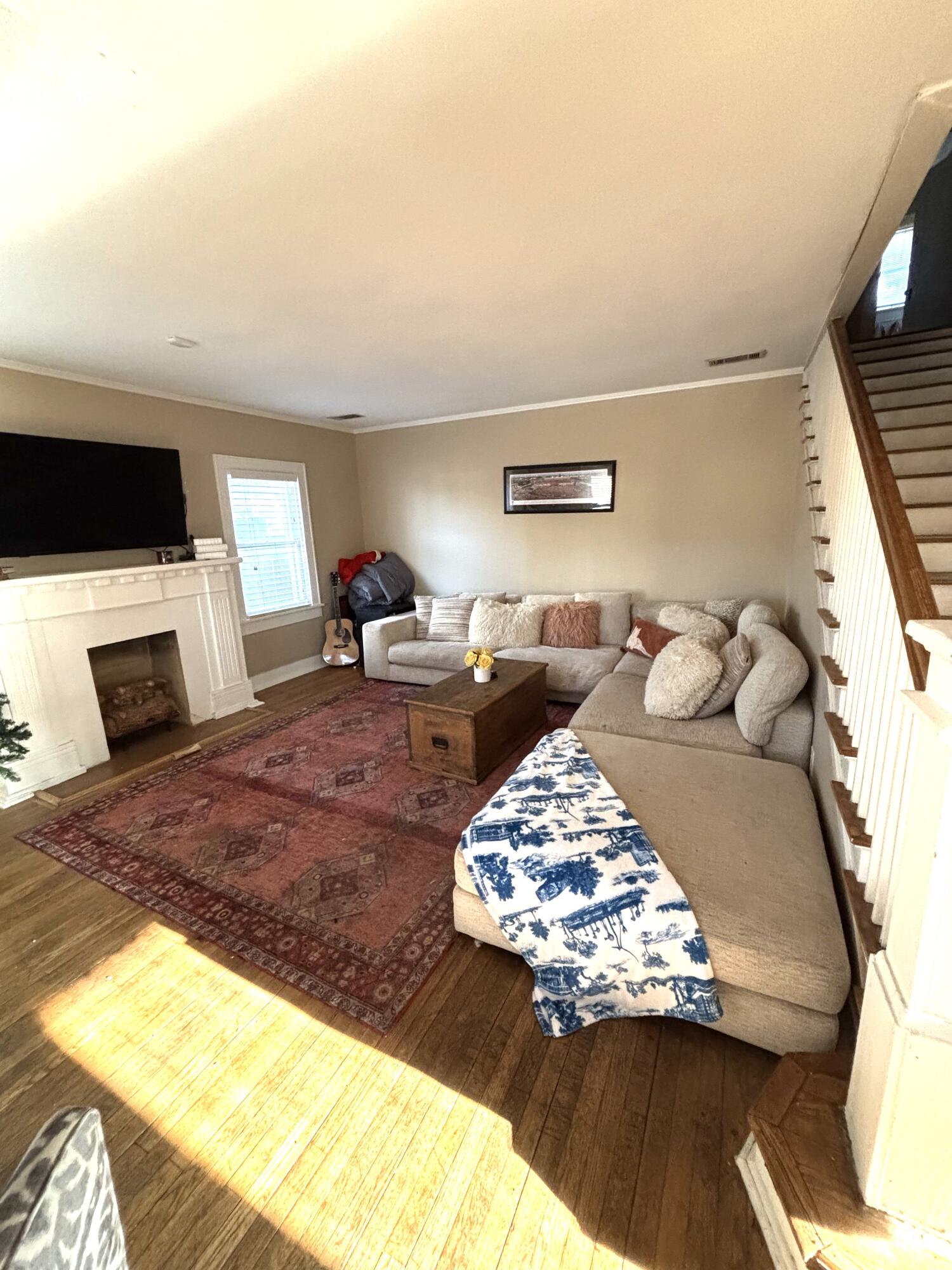 2315 16th Street Lubbock, TX 79401 - Photo 11 of 20 a living room with furniture and a flat screen tv