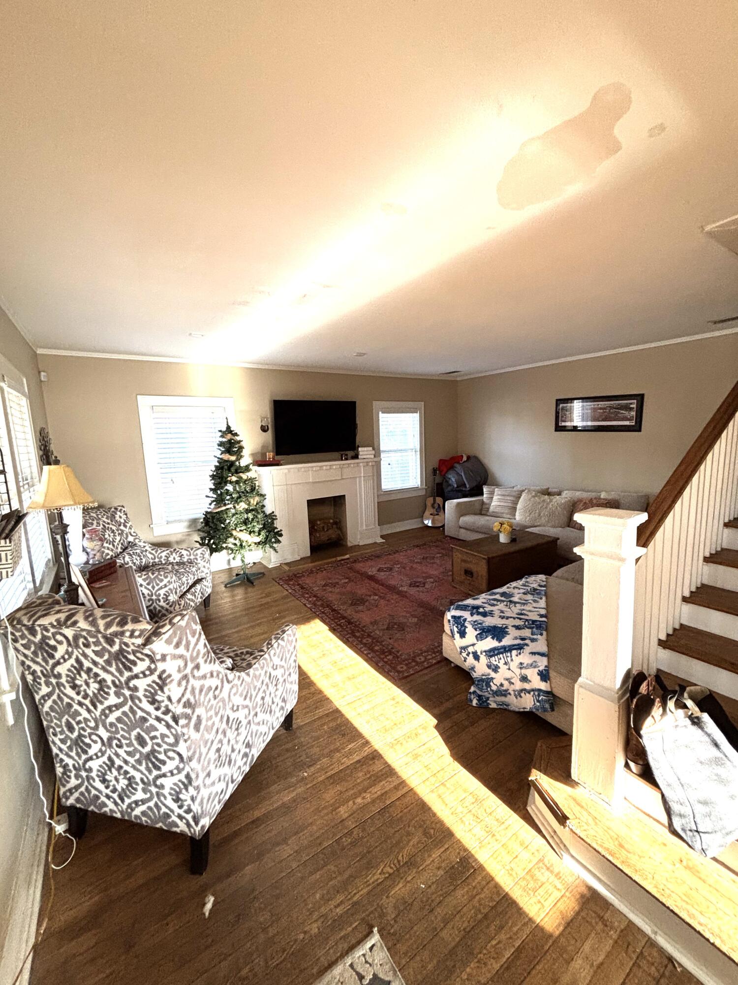 2315 16th Street Lubbock, TX 79401 - Photo 12 of 20 a living room with furniture and a fireplace