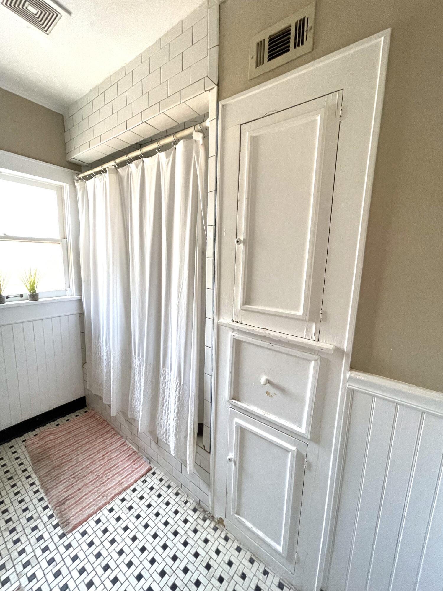 2315 16th Street Lubbock, TX 79401 - Photo 18 of 20 a view of a bathroom from a hallway
