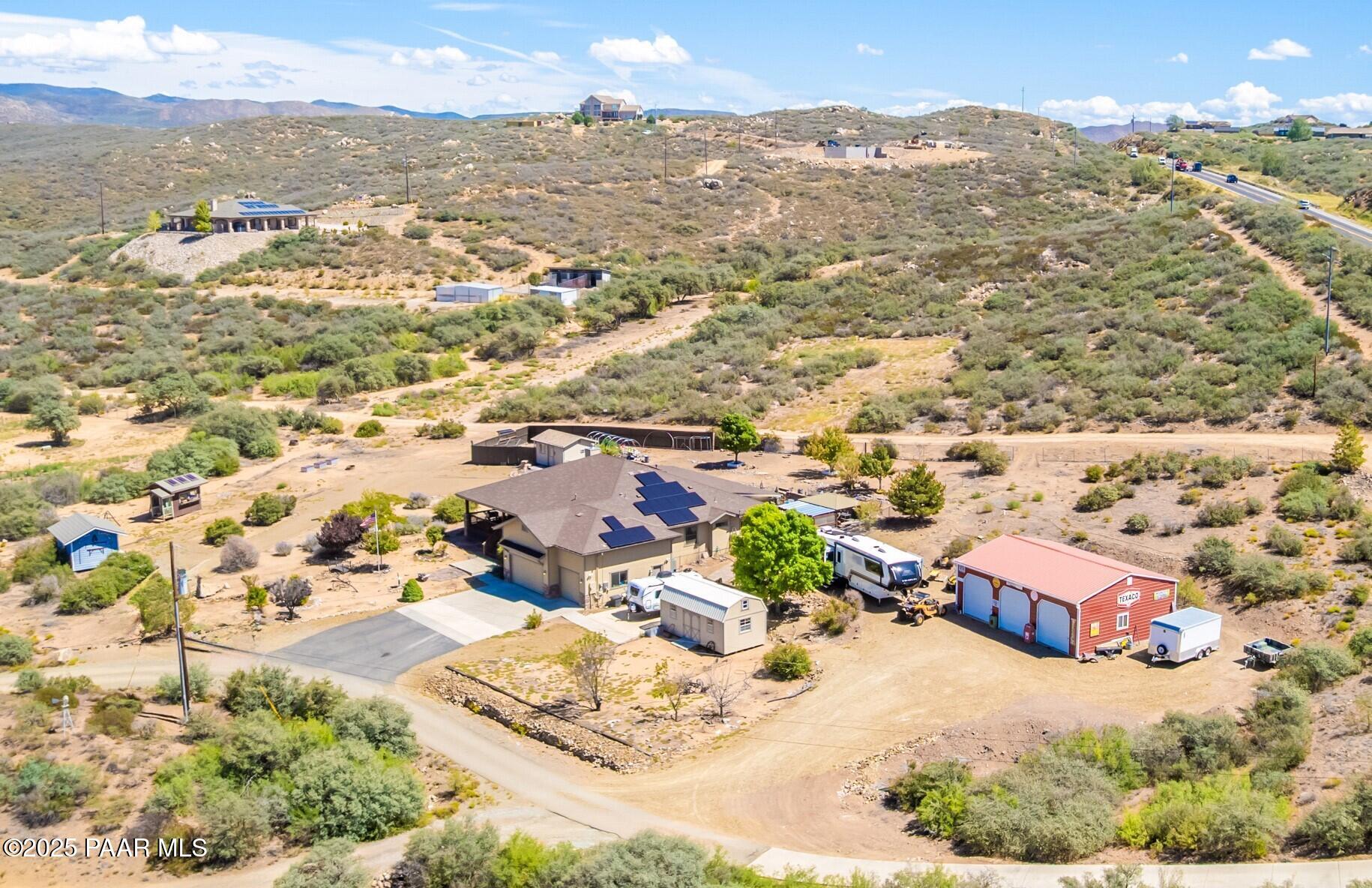 an aerial view of residential houses with outdoor space