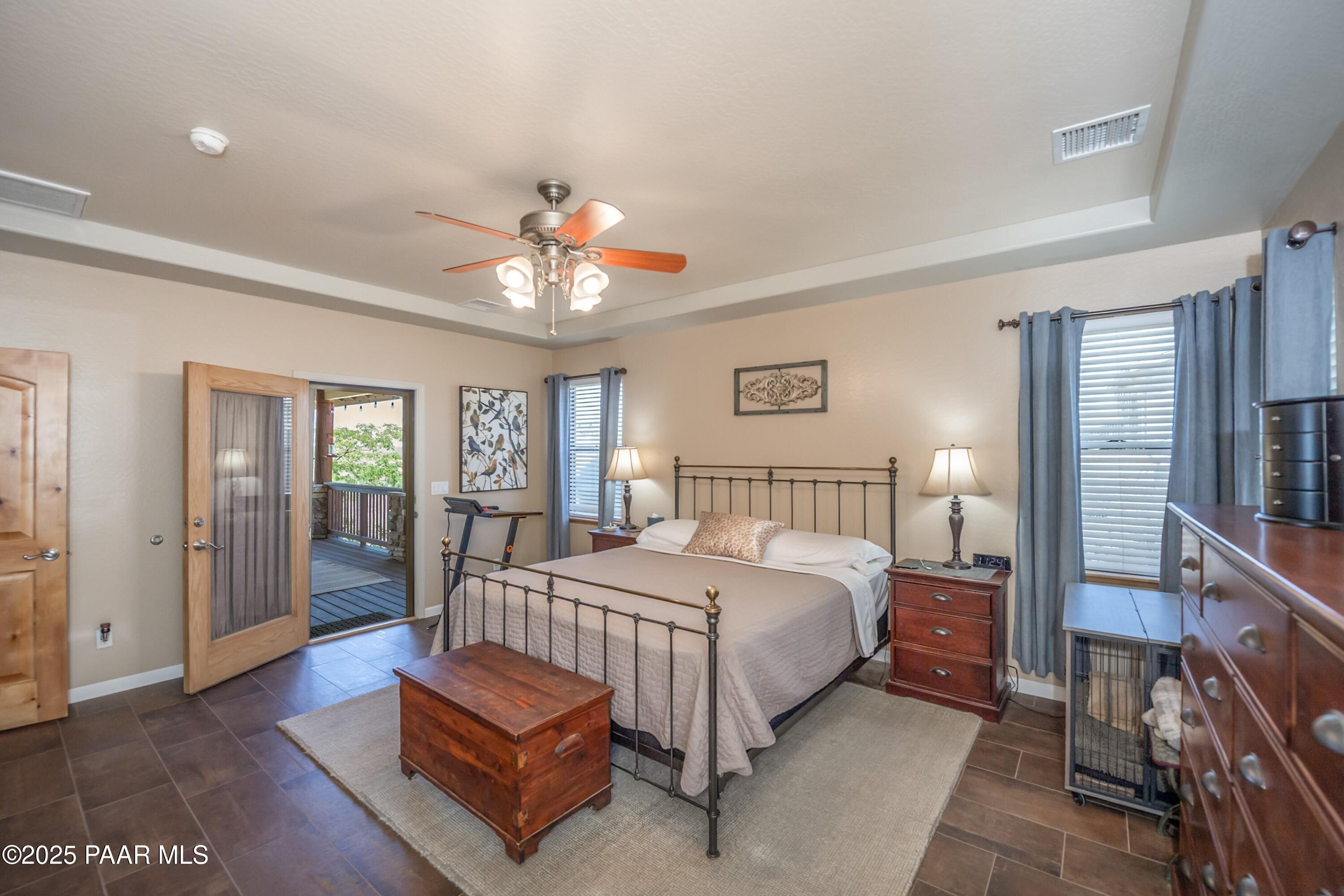 171 Enchanted Road Dewey, AZ 86327 - Photo 14 of 62 a bedroom with a bed chandelier and a window