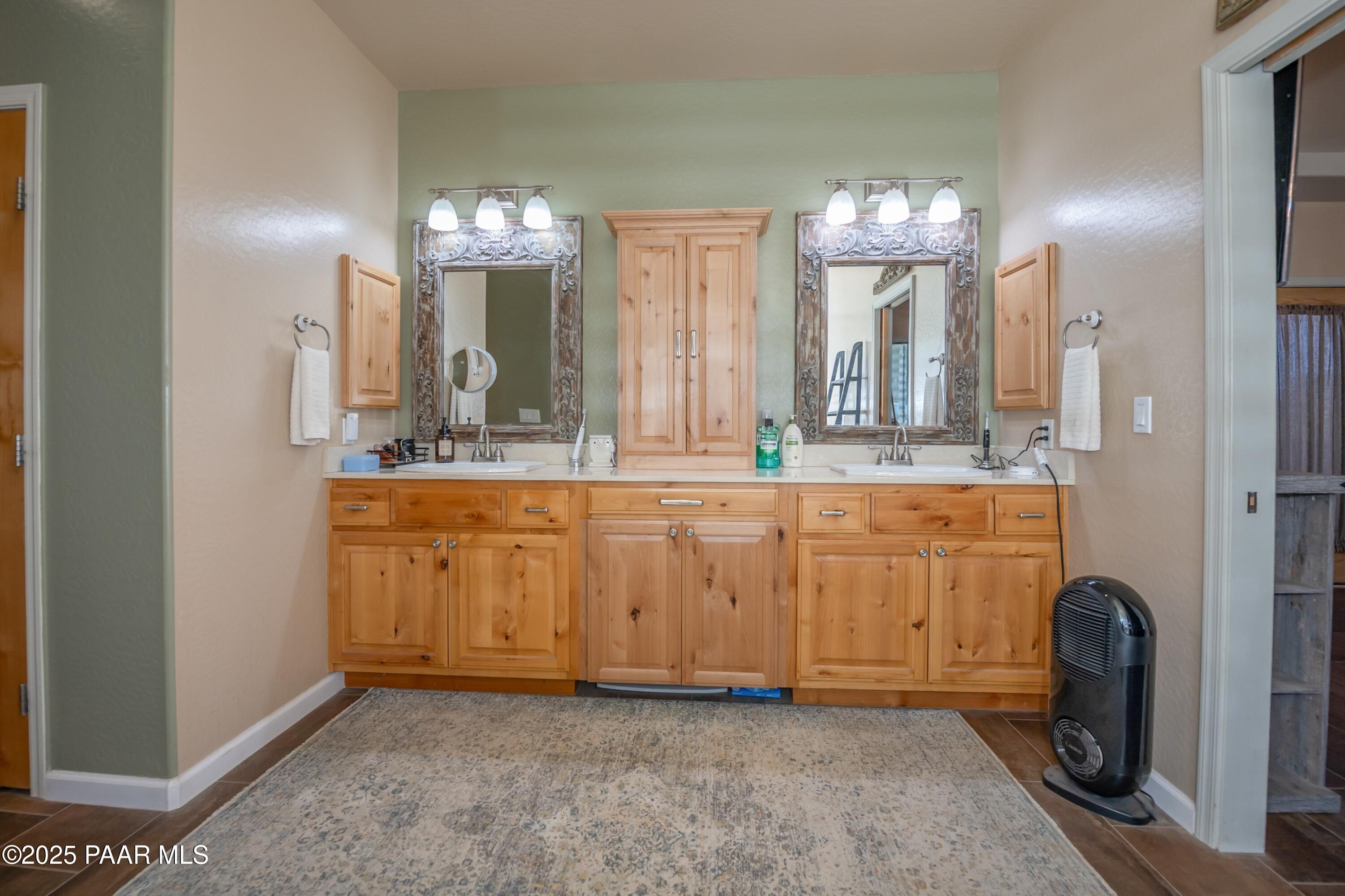 171 Enchanted Road Dewey, AZ 86327 - Photo 17 of 62 a bathroom with a sink and a mirror