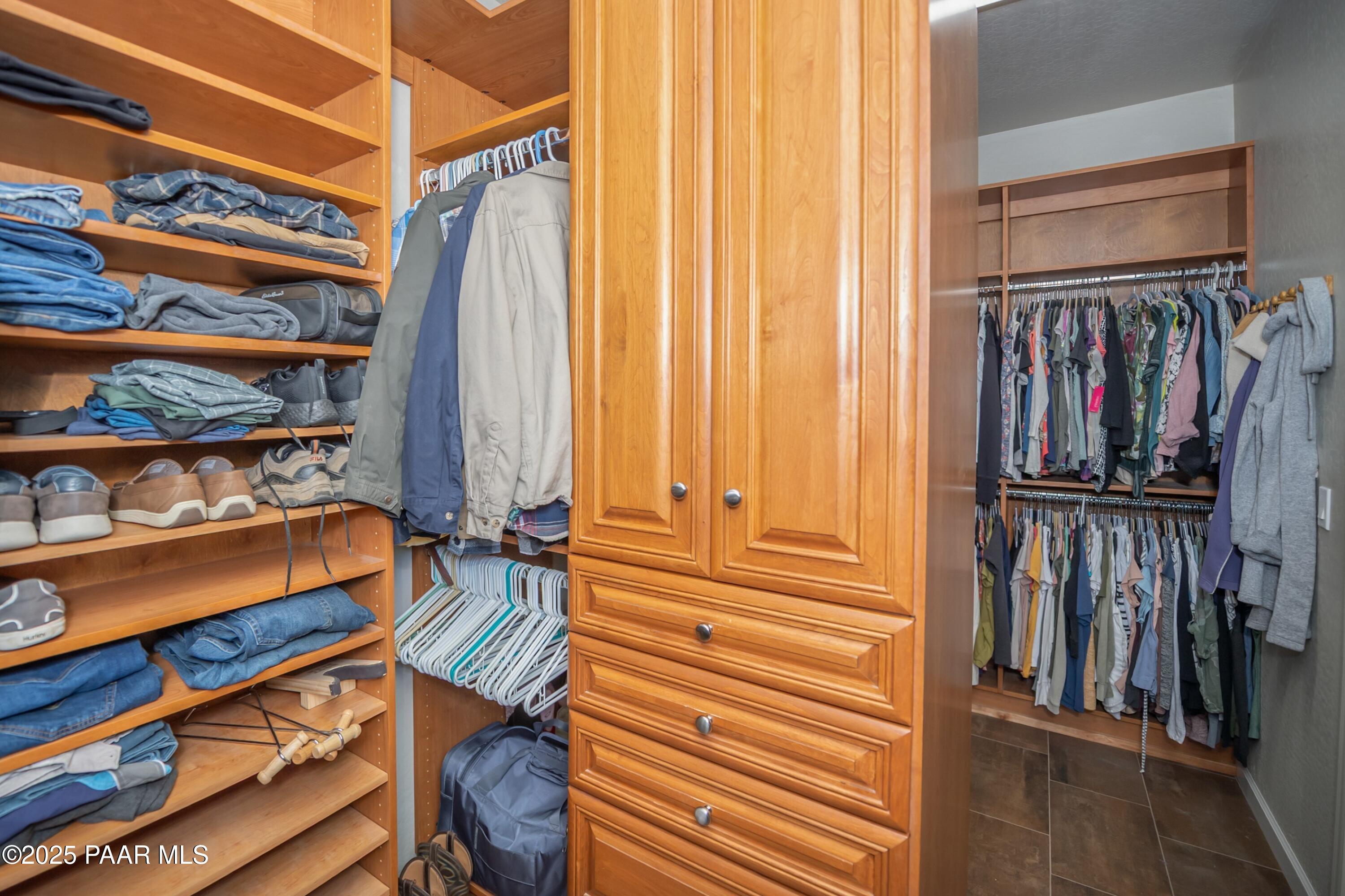 171 Enchanted Road Dewey, AZ 86327 - Photo 21 of 62 a view of walk in closet with clothes and shoes