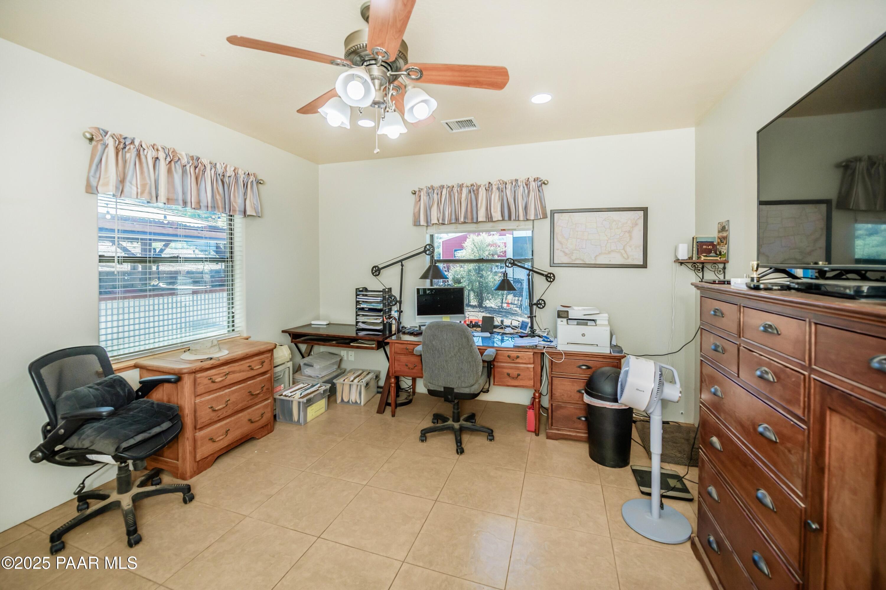 171 Enchanted Road Dewey, AZ 86327 - Photo 28 of 62 a view of a workspace with furniture and a window