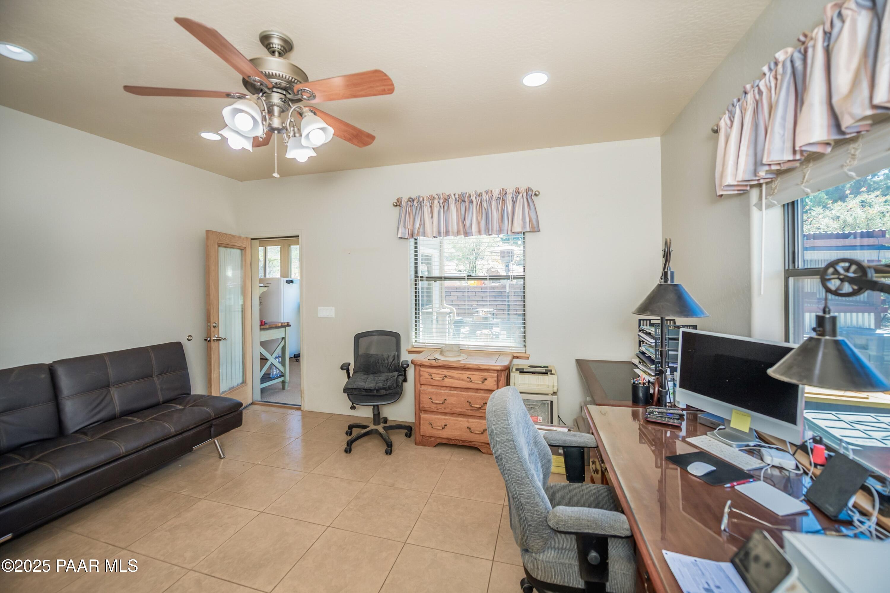 171 Enchanted Road Dewey, AZ 86327 - Photo 29 of 62 a view of a livingroom with workspace and a couch