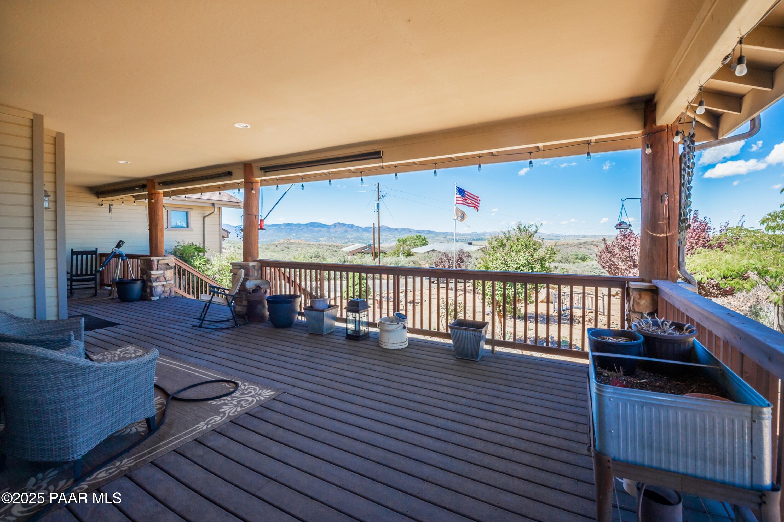 171 Enchanted Road Dewey, AZ 86327 - Photo 39 of 62 a view of a deck with wooden floor and outdoor seating