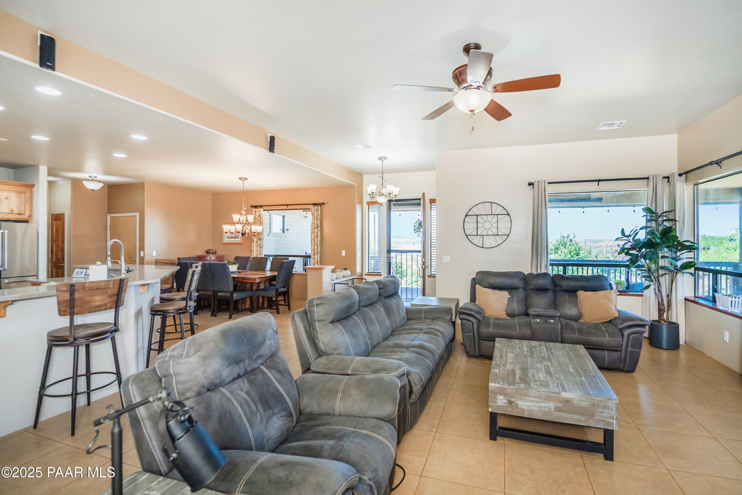 171 Enchanted Road Dewey, AZ 86327 - Photo 4 of 62 a living room with furniture and wooden floor