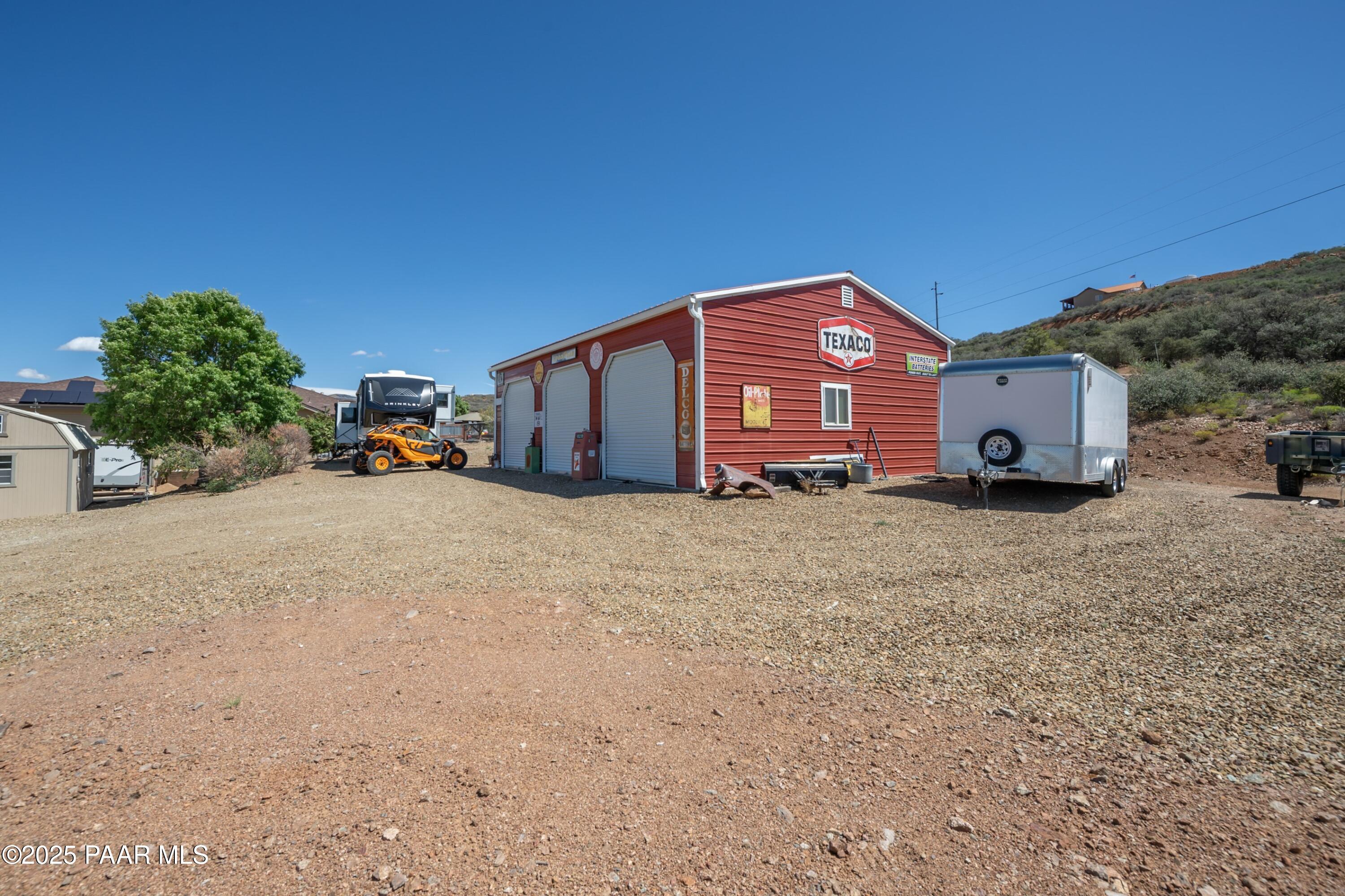 171 Enchanted Road Dewey, AZ 86327 - Photo 46 of 62 a front view of a house with large trees
