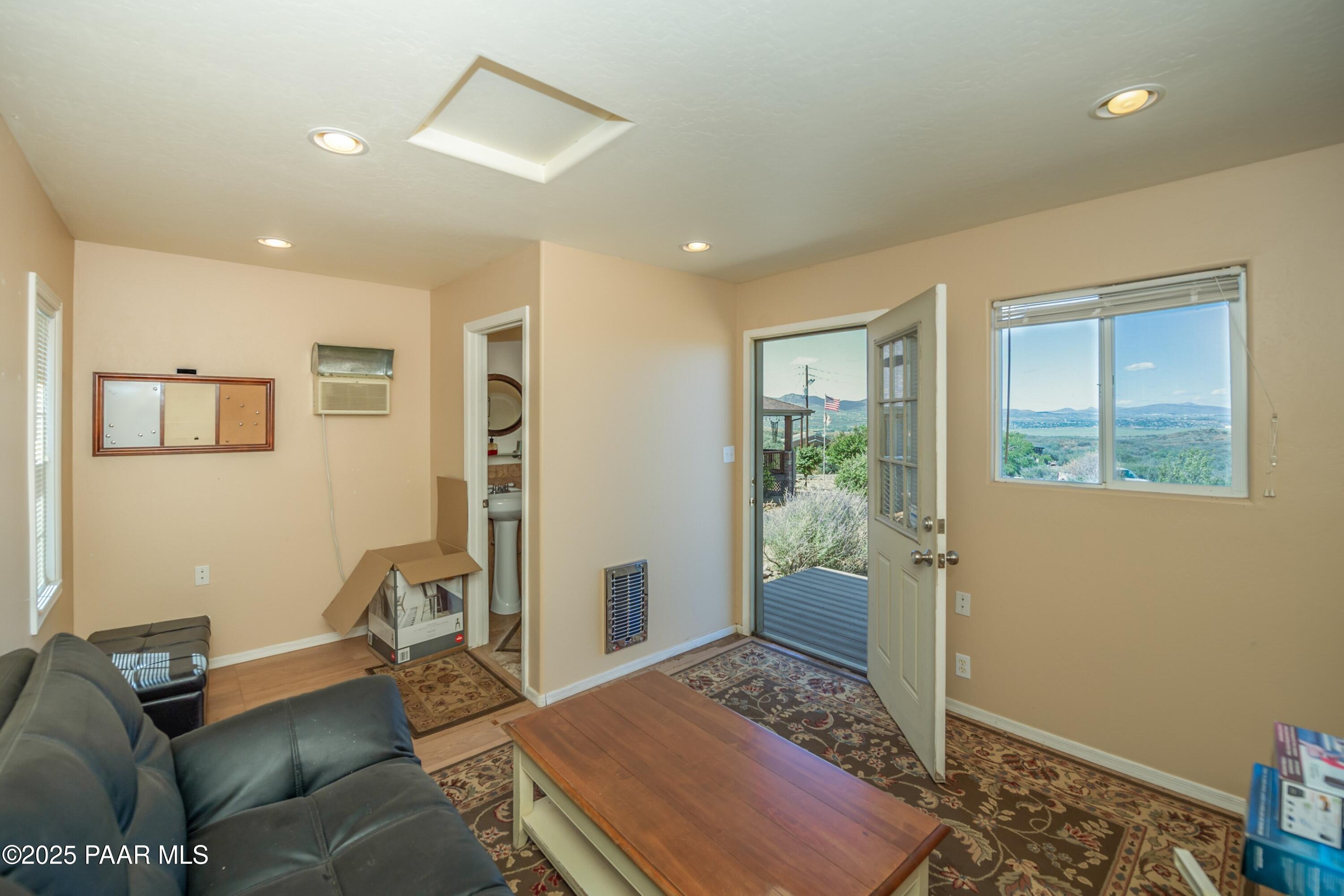 171 Enchanted Road Dewey, AZ 86327 - Photo 51 of 62 a bedroom with furniture and a window