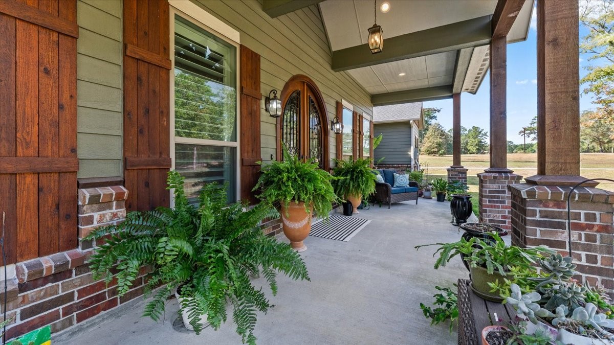 27785 Log Cabin Road Montgomery, TX 77356 - Photo 13 of 50 a couple of flower plants in front of a building