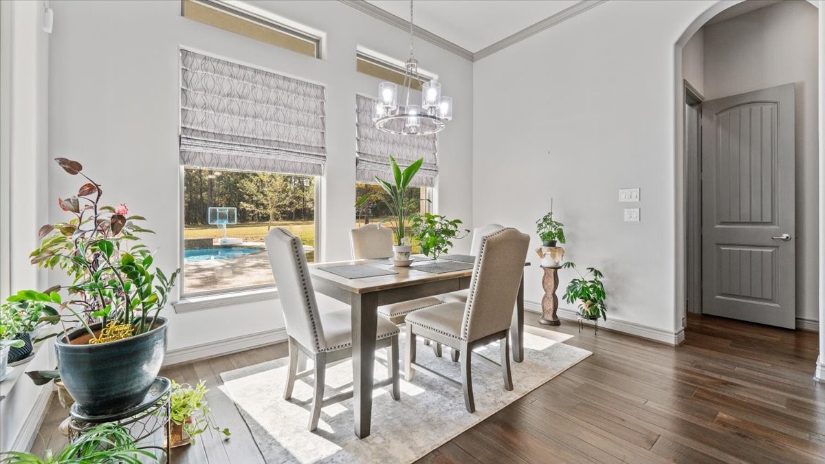 27785 Log Cabin Road Montgomery, TX 77356 - Photo 20 of 50 a view of a dining room with furniture window and wooden floor