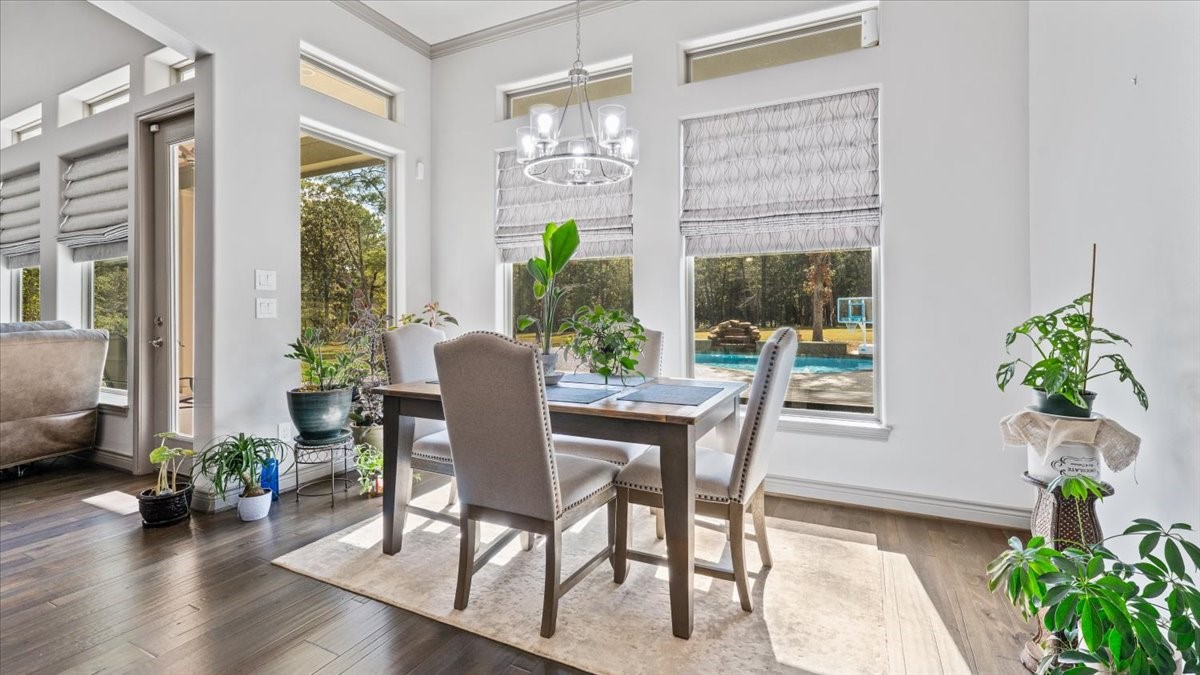 27785 Log Cabin Road Montgomery, TX 77356 - Photo 21 of 50 a view of a dining room with furniture window and wooden floor