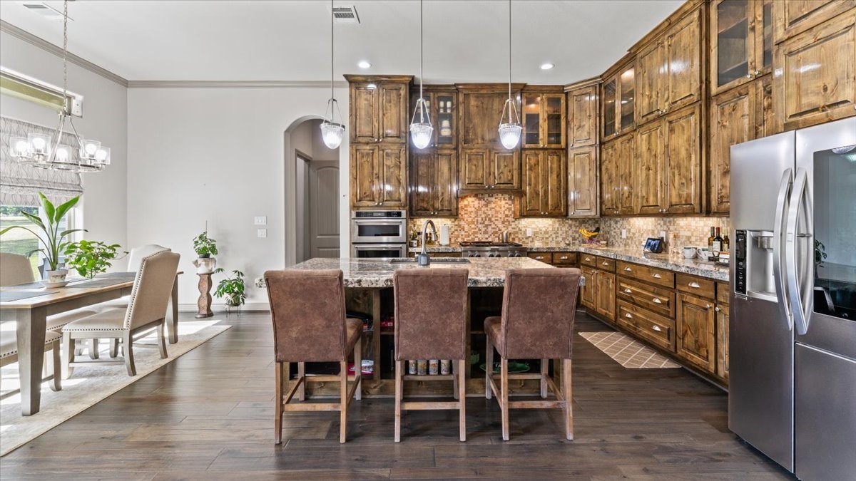 27785 Log Cabin Road Montgomery, TX 77356 - Photo 25 of 50 a dining table with chairs and window