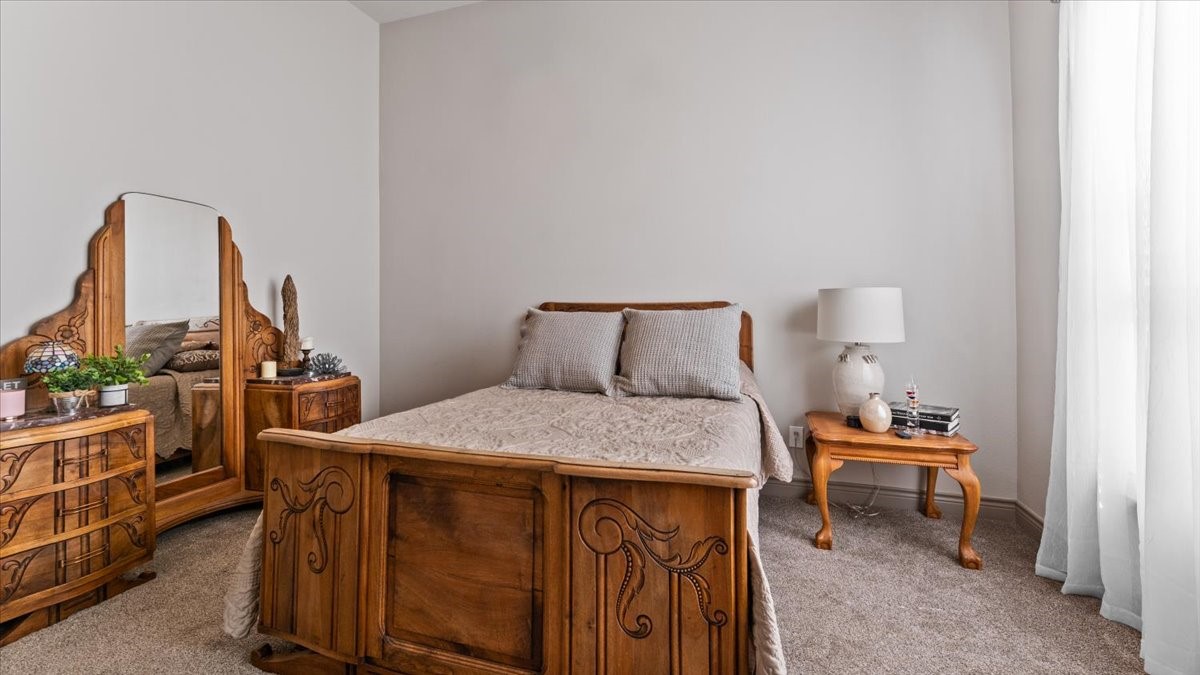 27785 Log Cabin Road Montgomery, TX 77356 - Photo 39 of 50 a bedroom with a bed and a table in it