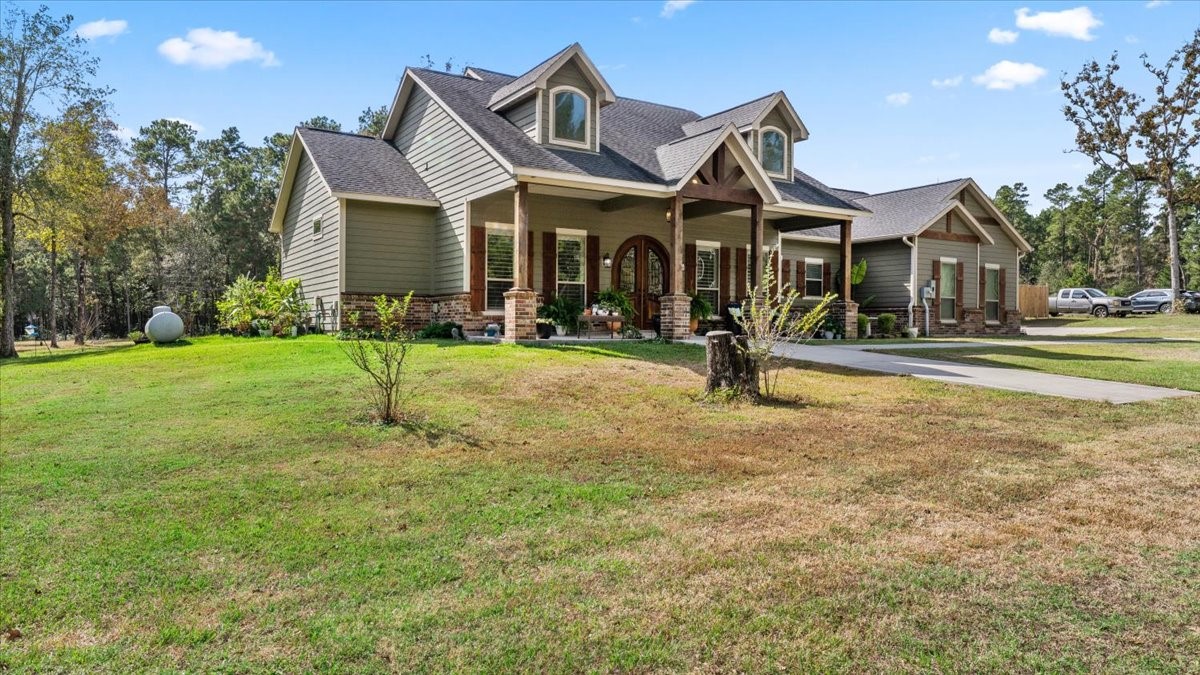 27785 Log Cabin Road Montgomery, TX 77356 - Photo 5 of 50 a front view of a house with a yard