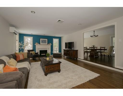 8 Saddle Club Road Lexington, MA 02420 - Photo 11 of 30 a living room with furniture flat screen tv and fireplace