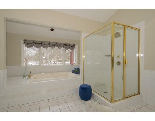 8 Saddle Club Road Lexington, MA 02420 - Photo 17 of 30 a bathroom with a bathtub and a shower