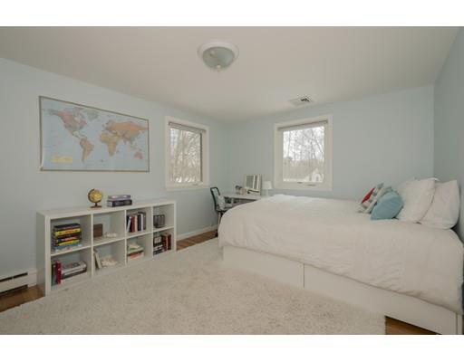 8 Saddle Club Road Lexington, MA 02420 - Photo 19 of 30 a bedroom with a bed and a cabinets