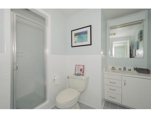 8 Saddle Club Road Lexington, MA 02420 - Photo 20 of 30 a bathroom with a toilet a sink and mirror