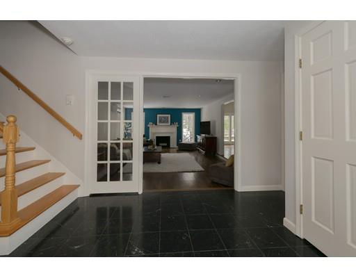 8 Saddle Club Road Lexington, MA 02420 - Photo 2 of 30 a living room with furniture and floor to ceiling windows