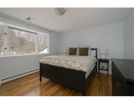 8 Saddle Club Road Lexington, MA 02420 - Photo 21 of 30 a bedroom with a bed and wooden floor