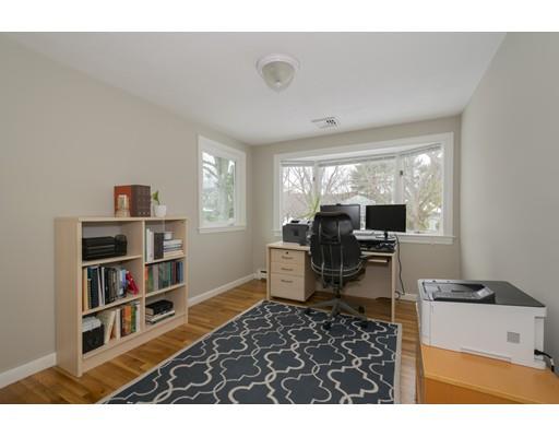 8 Saddle Club Road Lexington, MA 02420 - Photo 23 of 30 a living room with furniture and a flat screen tv