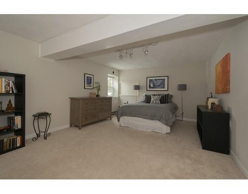 8 Saddle Club Road Lexington, MA 02420 - Photo 24 of 30 a living room with furniture and a flat screen tv