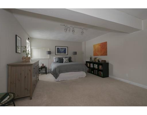 8 Saddle Club Road Lexington, MA 02420 - Photo 25 of 30 a living room with furniture and a lamp