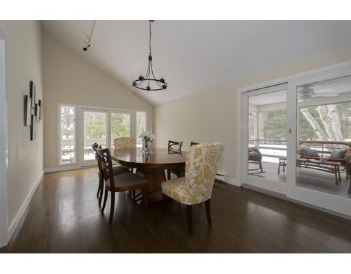 8 Saddle Club Road Lexington, MA 02420 - Photo 8 of 30 a view of a dining room with furniture window and wooden floor