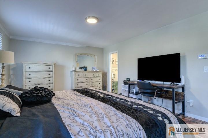 16 Pendleton Place Old Bridge, NJ 08857 - Photo 11 of 30 a bedroom with a bed and a flat screen tv