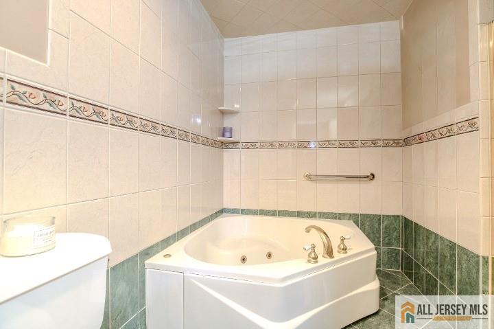 16 Pendleton Place Old Bridge, NJ 08857 - Photo 13 of 30 a bathroom with a bath tub and a shower