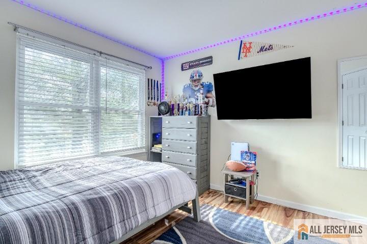 16 Pendleton Place Old Bridge, NJ 08857 - Photo 17 of 30 a bedroom with a bed and flat screen tv
