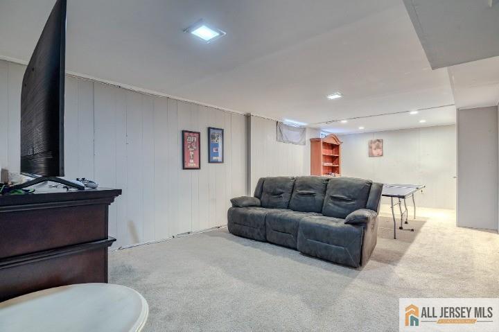 16 Pendleton Place Old Bridge, NJ 08857 - Photo 22 of 30 a living room with furniture and a flat screen tv