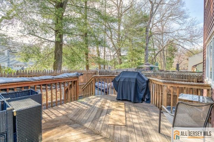 16 Pendleton Place Old Bridge, NJ 08857 - Photo 26 of 30 a view of a roof deck with wooden chairs and a fire pit