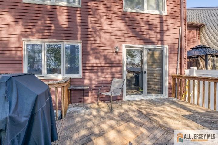 16 Pendleton Place Old Bridge, NJ 08857 - Photo 27 of 30 a backyard of a house with barbeque oven table and chairs