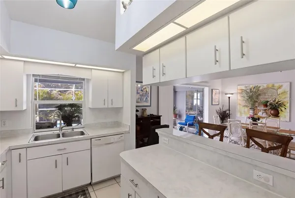 a kitchen with sink and cabinets