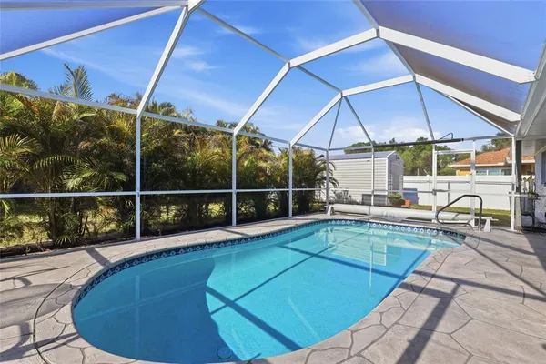 a view of a swimming pool with a patio