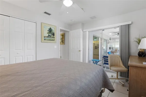 a bedroom with a bed and a view of bathroom