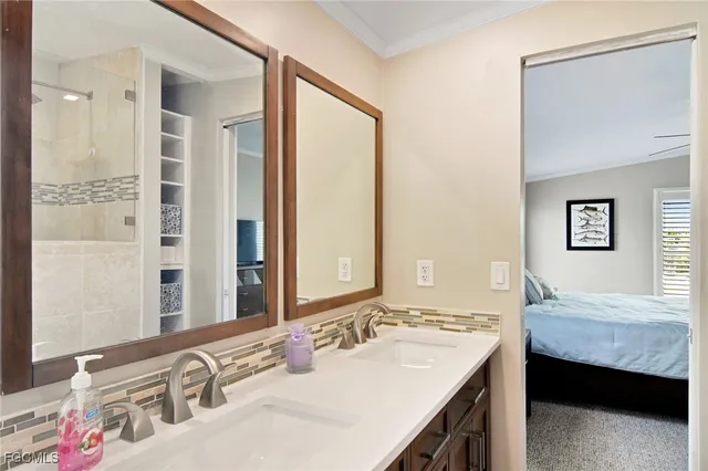 a en suite bathroom with a sink and a mirror