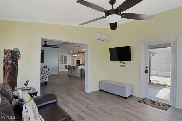 a living room with furniture and a flat screen tv