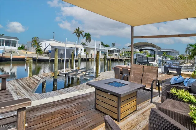 a view of a chairs and table on the deck